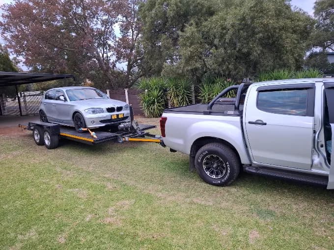 ASD Towing collecting a silver BMW on a flatbed trailer